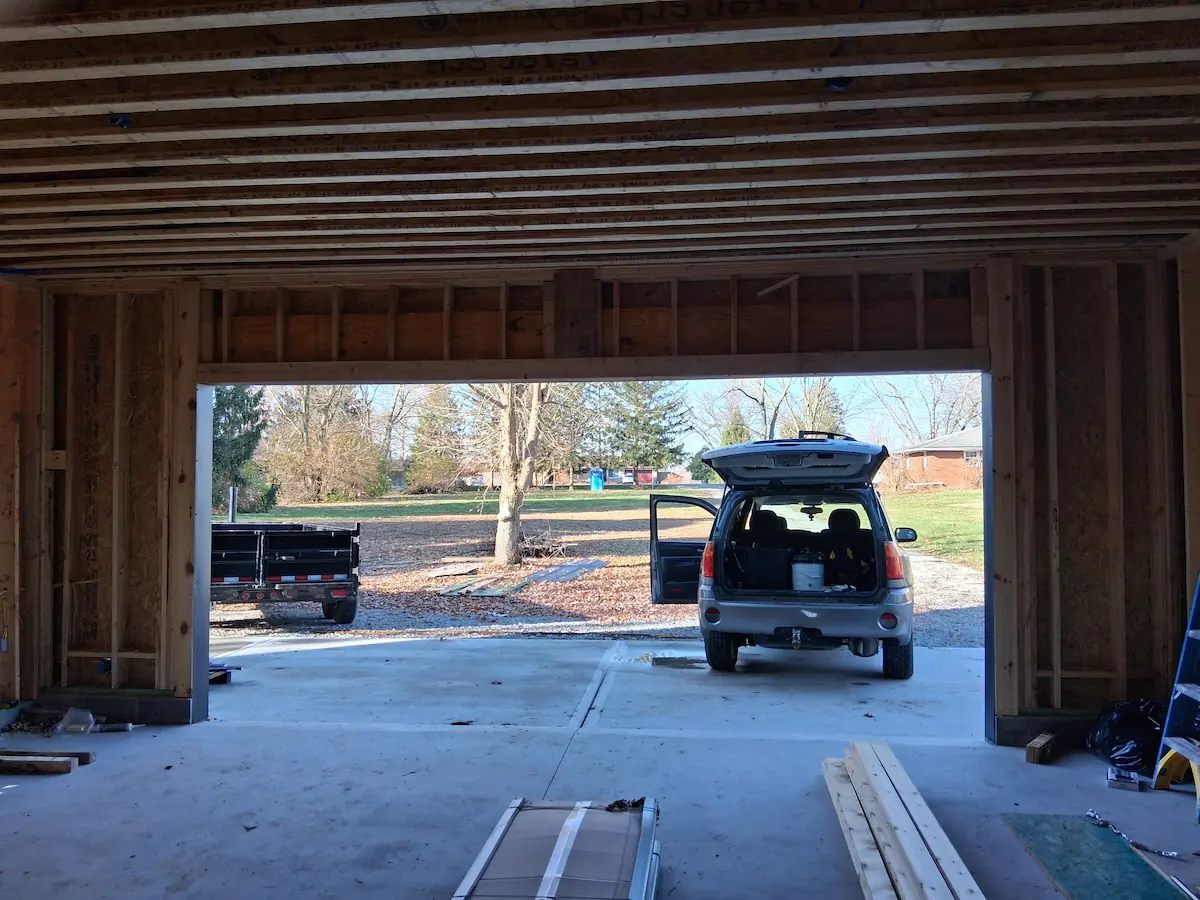 Custom overhead garage door track and opening mechanism